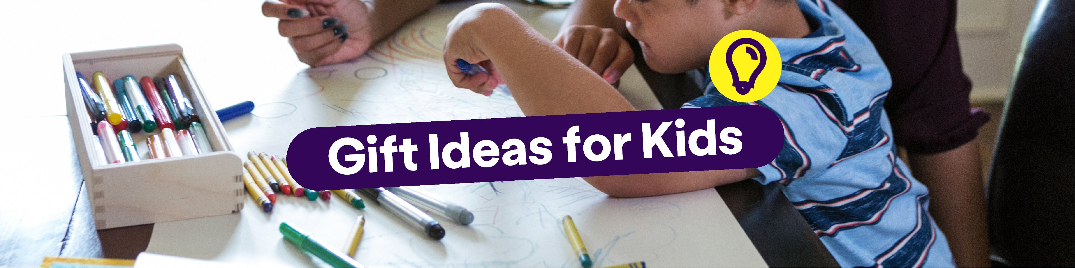 A banner featuring an image of a young child wearing a blye t-shirt colouring with pens. The title says: 'Gift Ideas for Kids'.