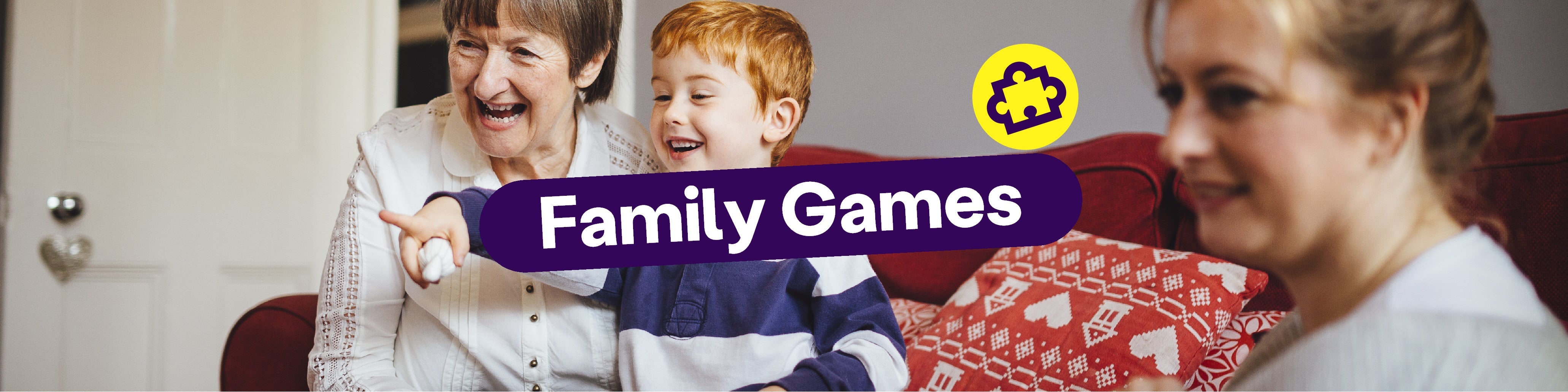A banner featuring a family of two women and a young child laughing in a living room playing a game. The title reads: "Family Games".