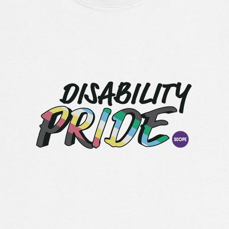 Text on a white t-shirt that reads Disability Pride in capitals. The word Pride is filled in with the striped colours of the disability pride flag. A small Scope logo sits beside it like a full stop. 